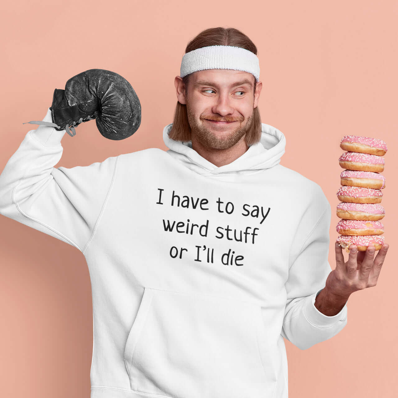 funny man wearing hoodie that says I have to say weird stuff or i'll die holding donuts