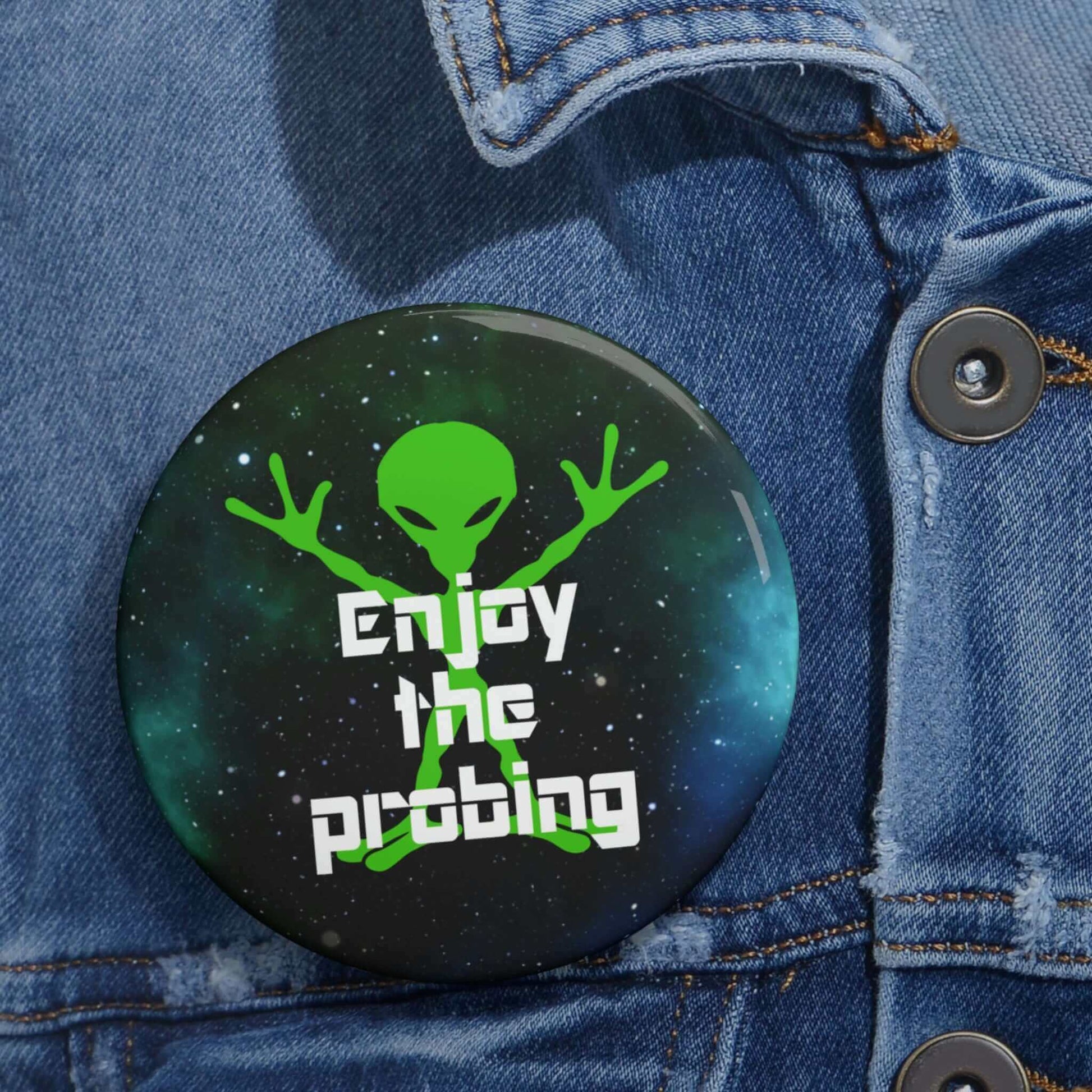 Funny pin-back button with image of an alien and the words Enjoy the probing.