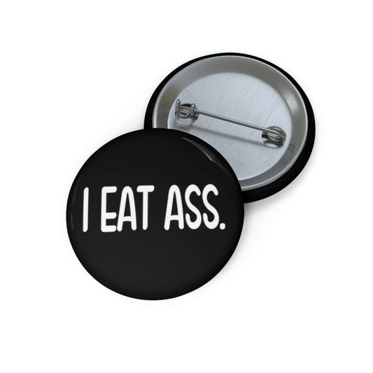 Pin-back button that says I eat ass.