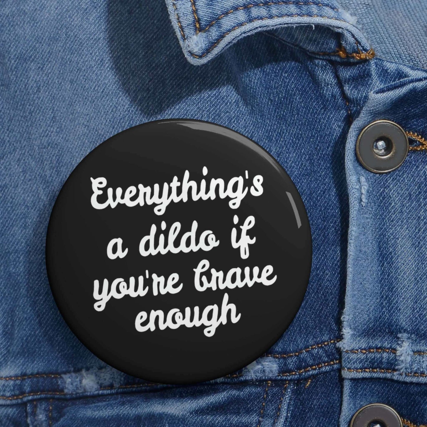 Witticisms r us button infographic.Black pinback button that says Everything's a dildo if you're brave enough.