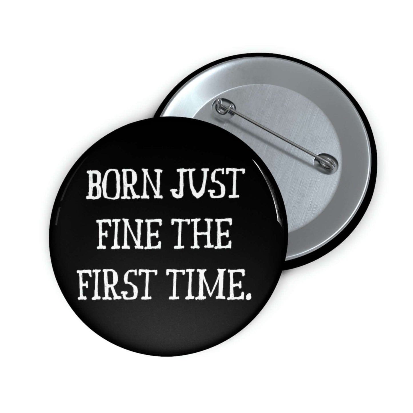 Black pinback button that says Born just fine the first time.