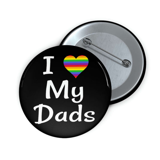 Black pin-back button that says I heart my dads. The heart is rainbow.