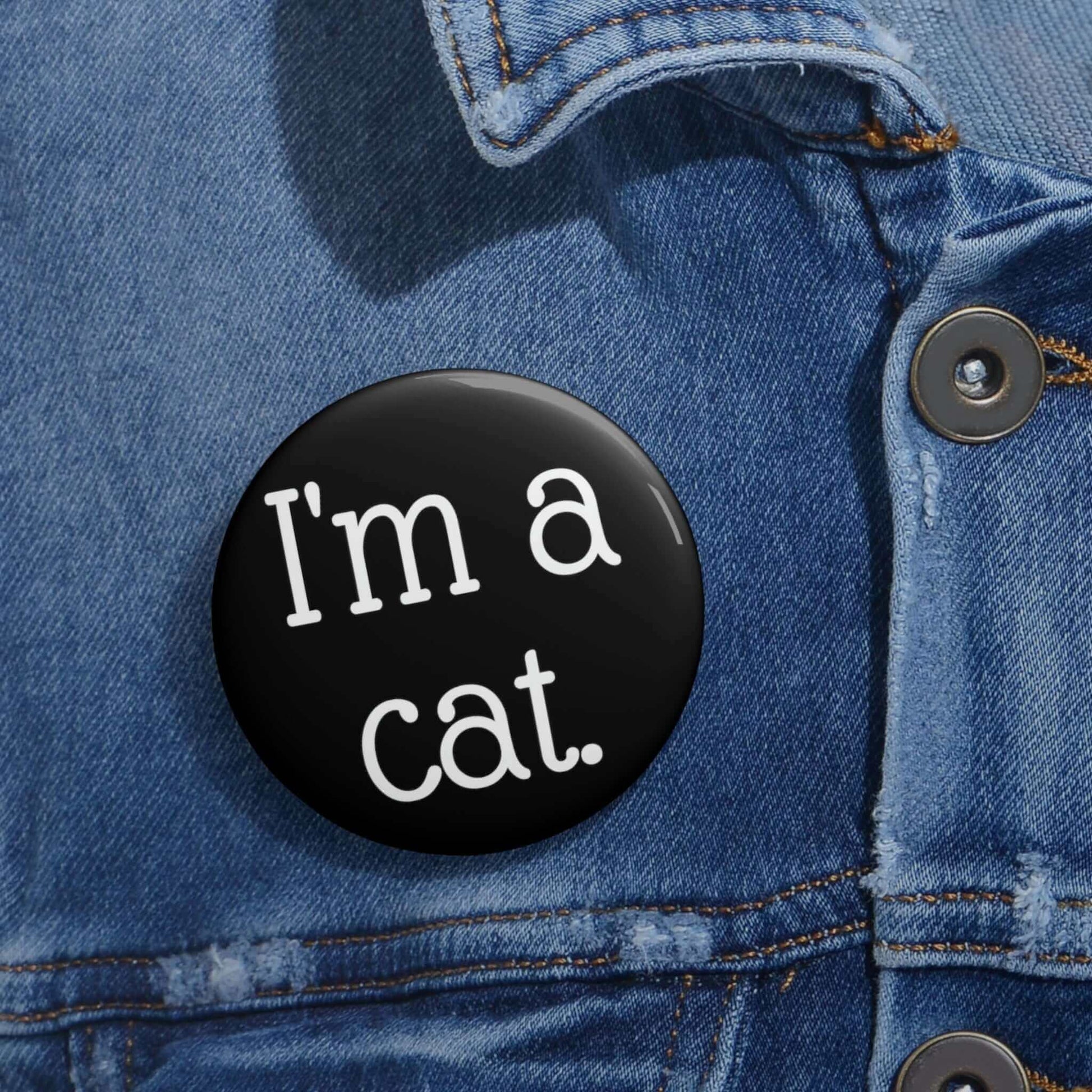 Black pinback button that says I'm a cat.