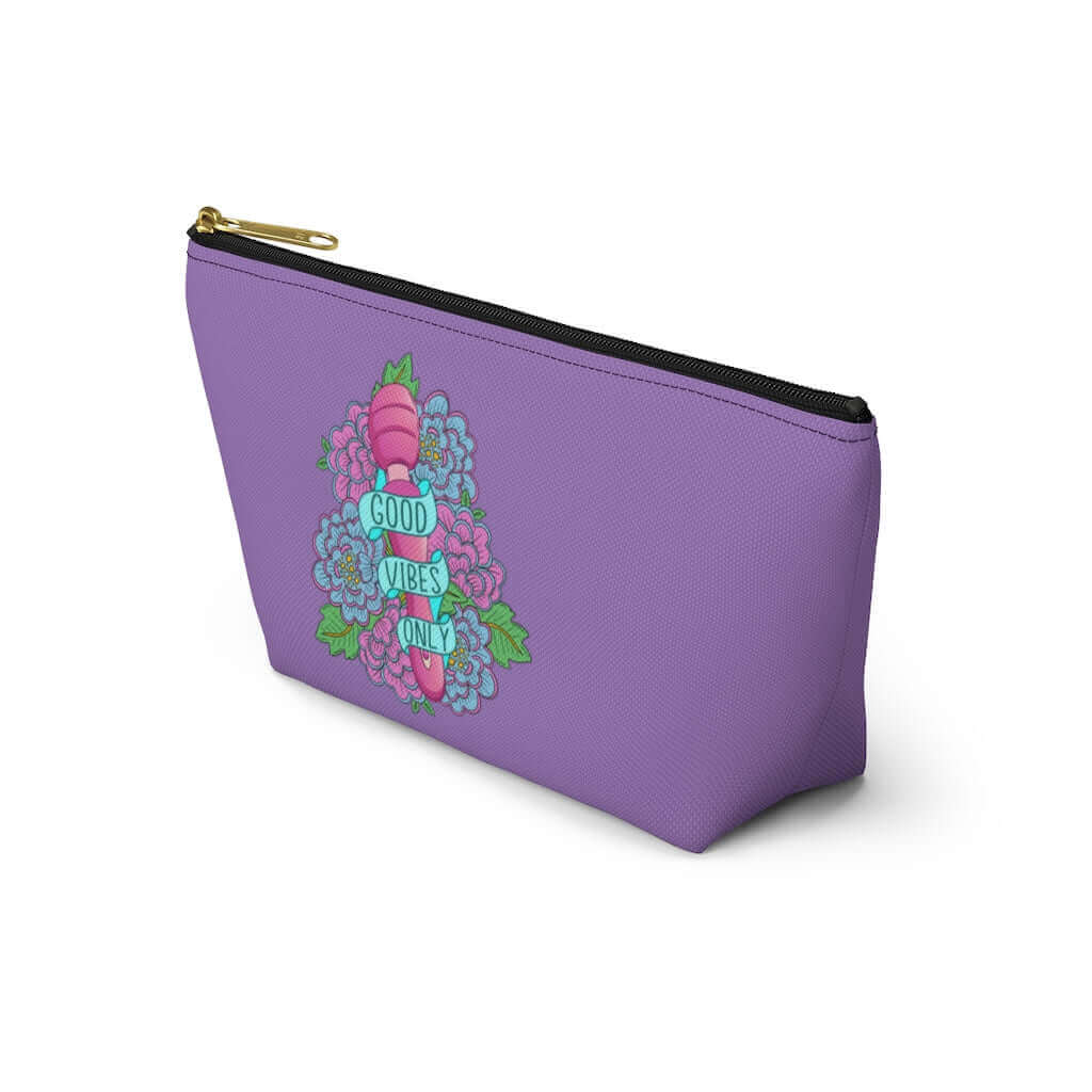 Light purple zipper pouch with graphic design that has the words Good vibes only layered over a pink wand vibrator with flowers around. The graphic design is printed on both sides of the bag.