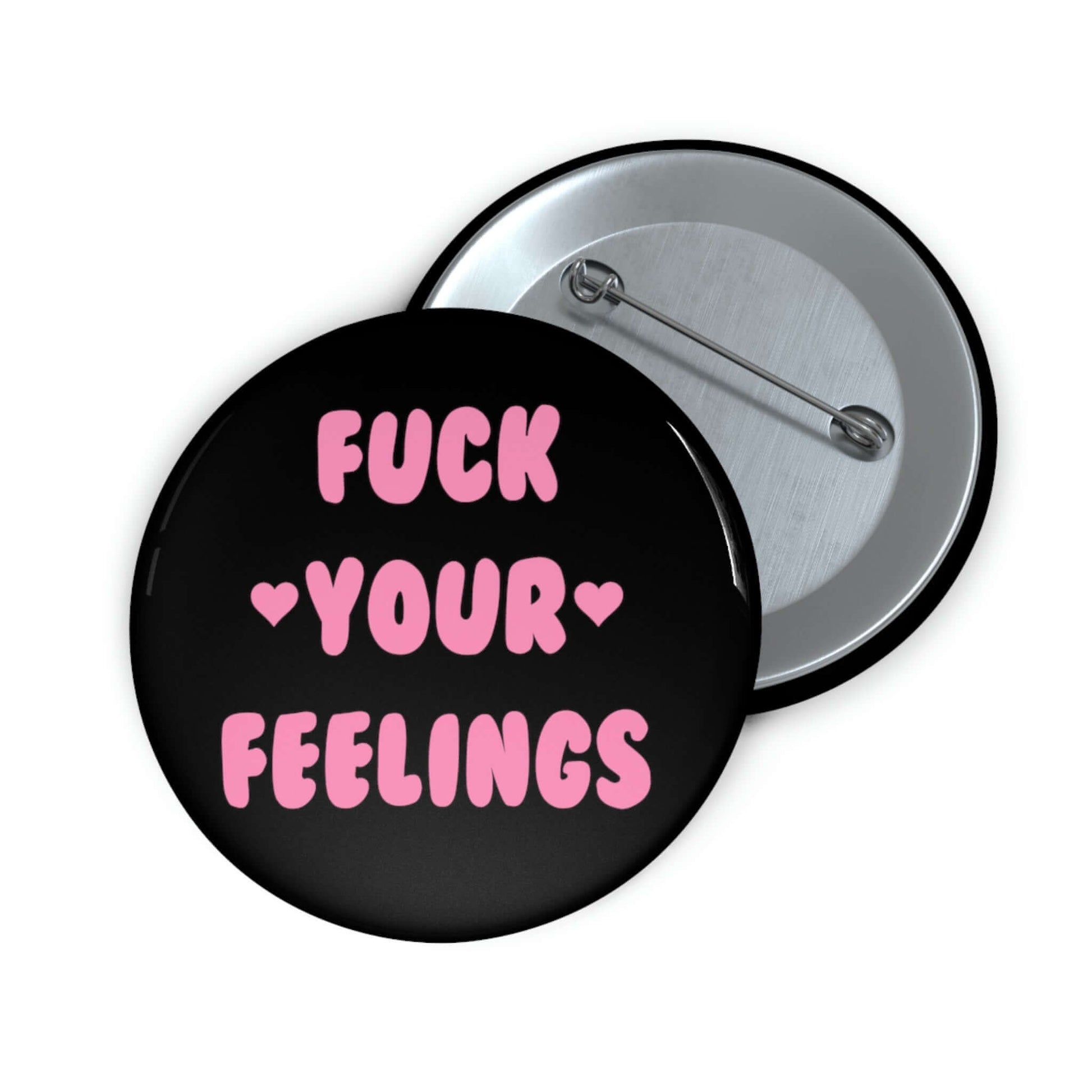 Black pinback button that says Fuck your feelings in pink. 