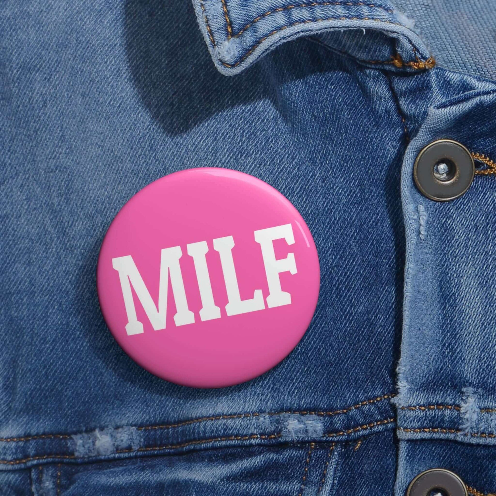 Bright pink pin-back button with the acronym MILF.