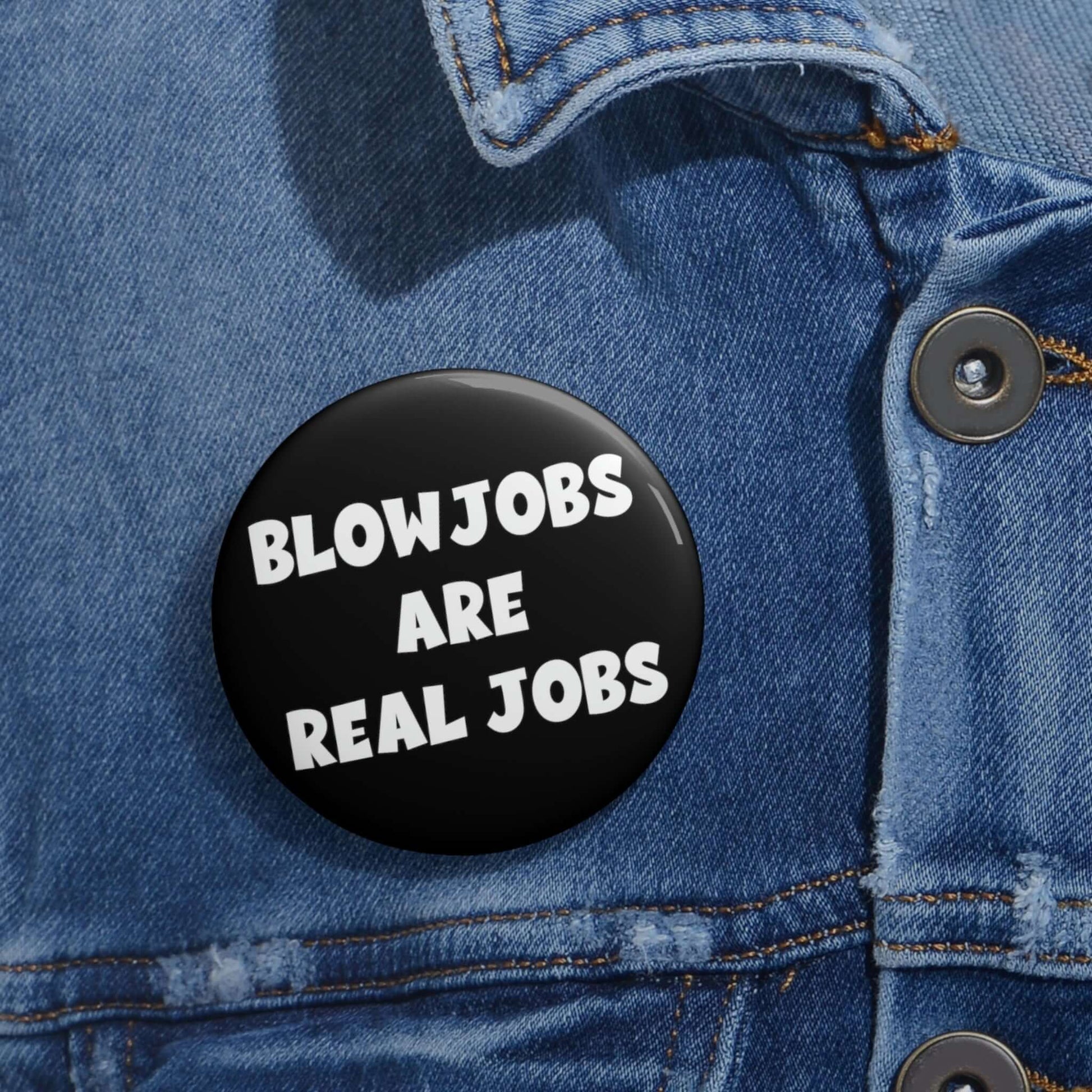 Black pinback button that says Blowjobs are real jobs.