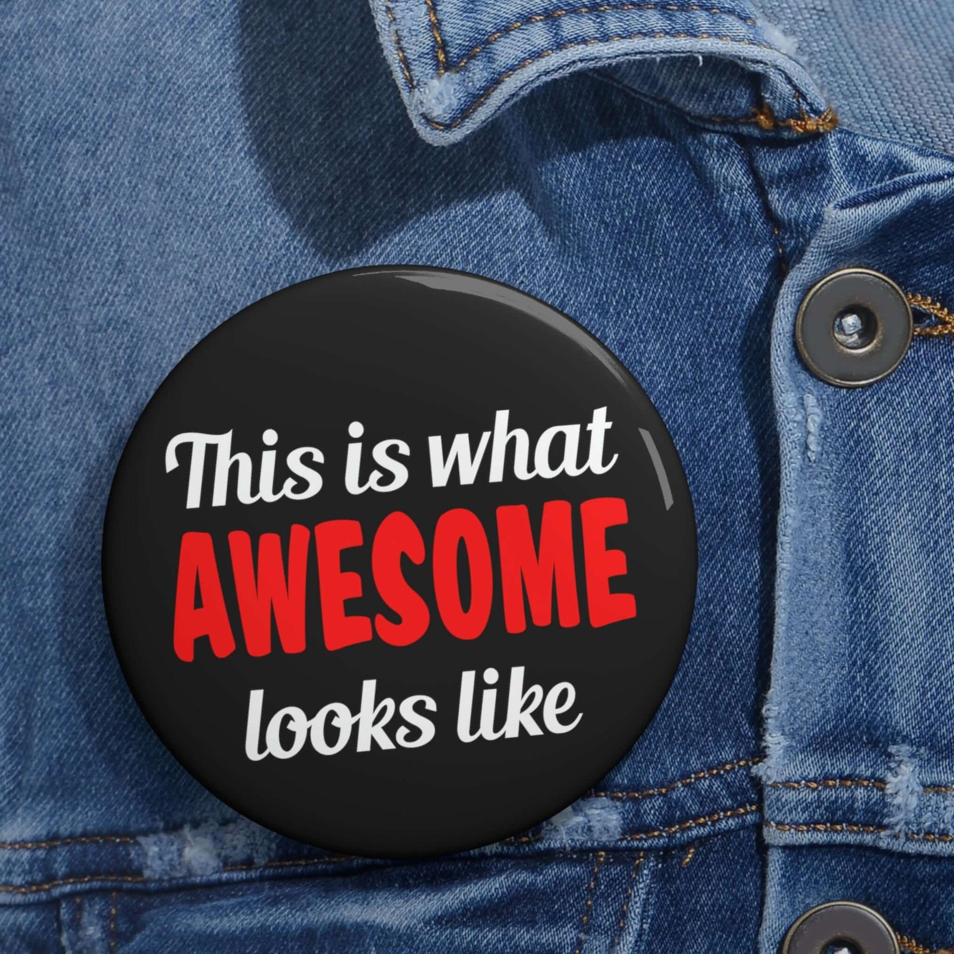 Black pinback button that says This is what awesome looks like. The word awesome is bright red.