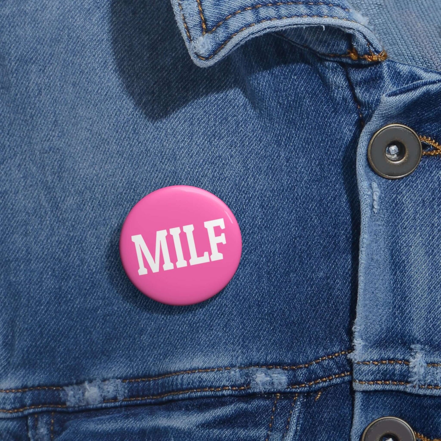 Bright pink pin-back button with the acronym MILF.