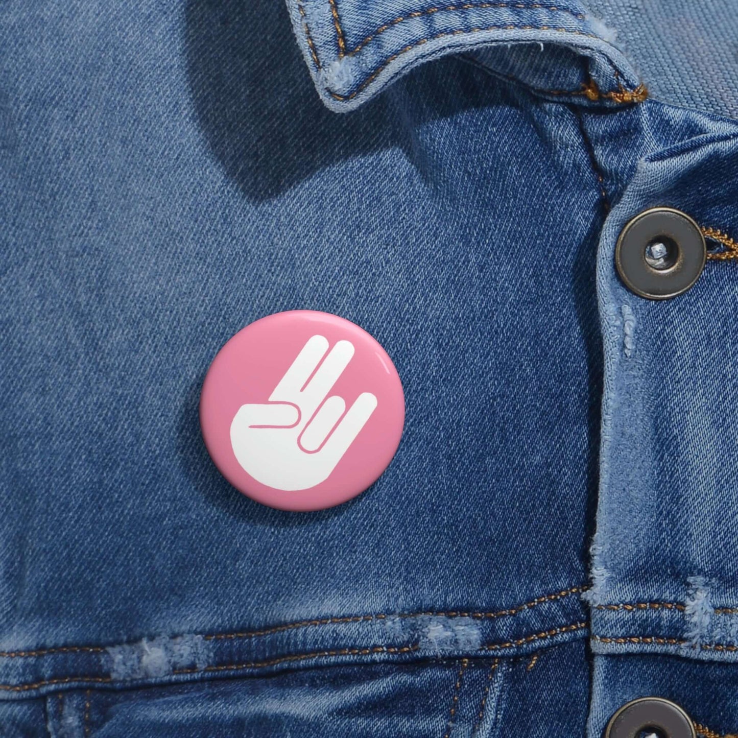 The shocker symbol on pink background pinback button.