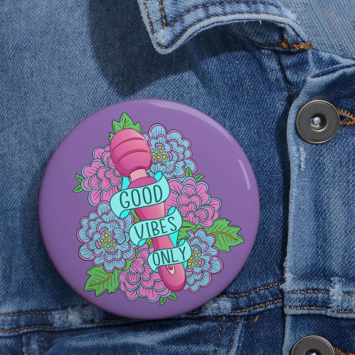 Pinback button with Good vibes only layered over a pink wand vibrator with flowers around and purple background.