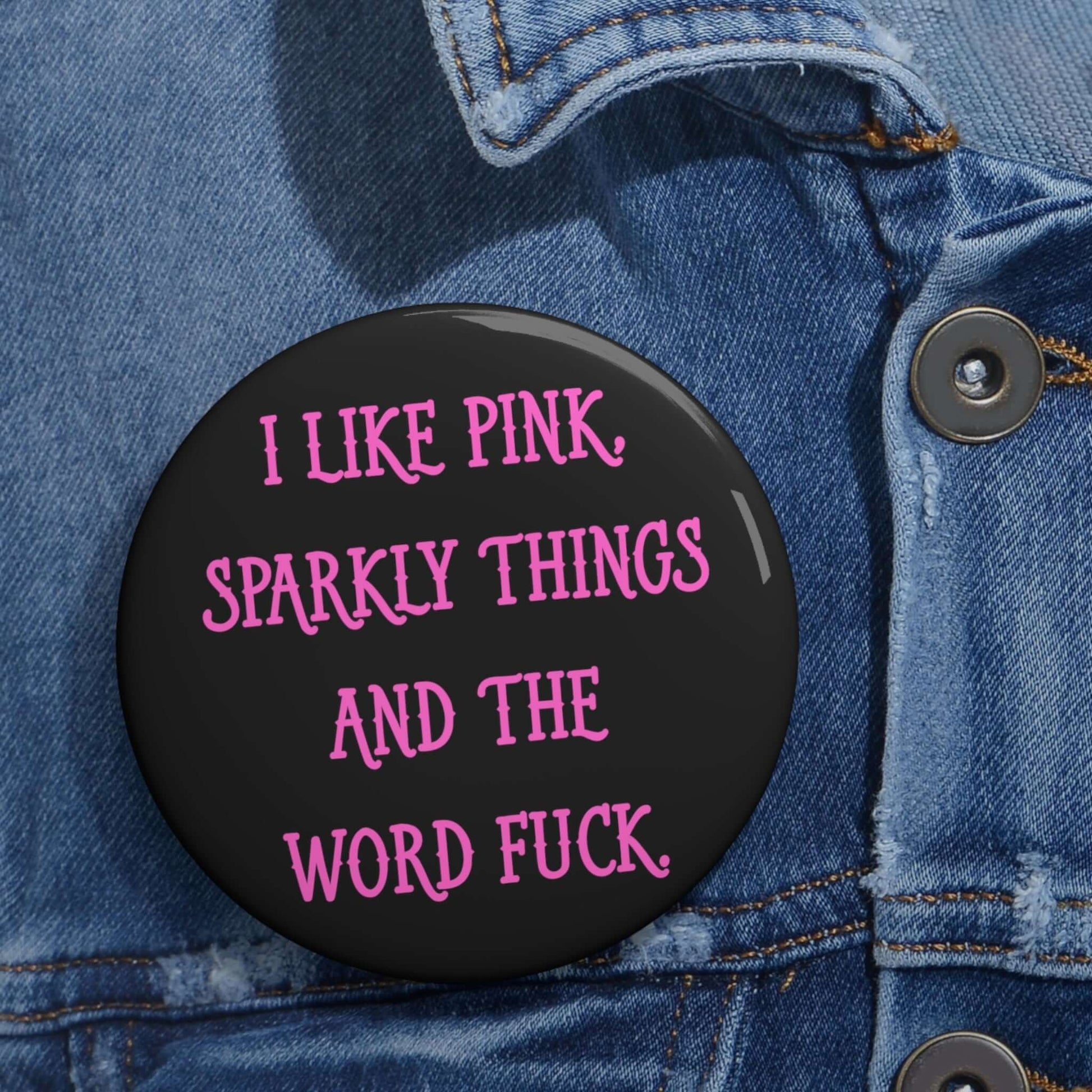 Pin-back button that says I like pink, sparkly things and the word fuck printed in pink font.