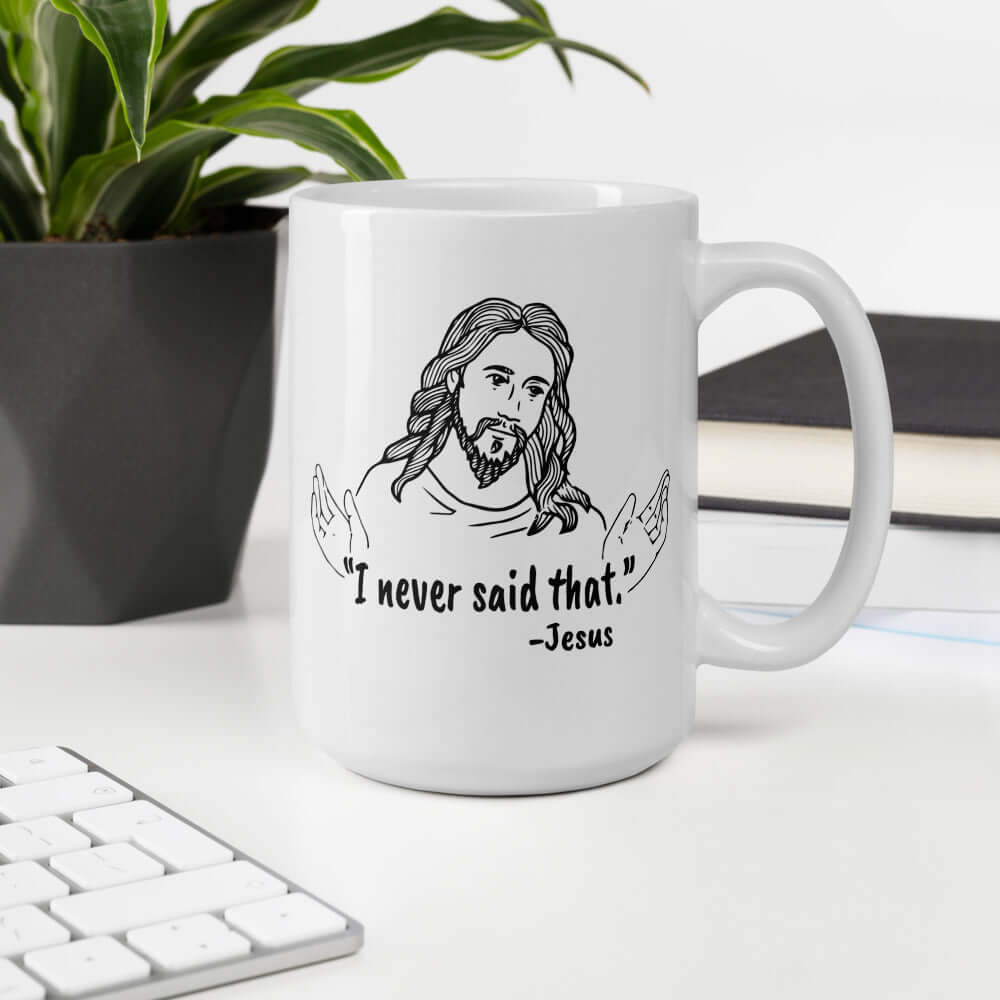 White ceramic coffee mug with a line drawing of Jesus with his hands outstretched and the quote I never said that printed on both sides.