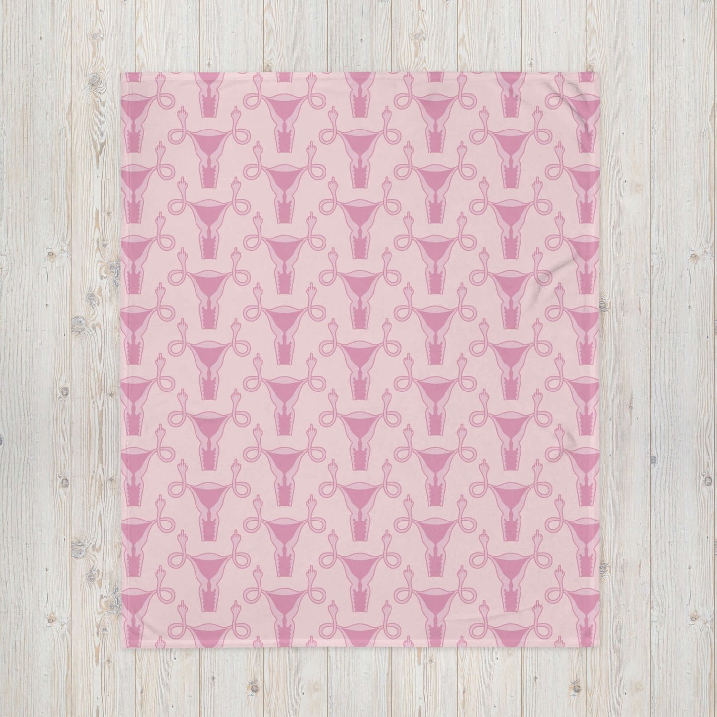 Pink fleece throw blanket with pink uterus flipping middle finger graphic printed all over by witticisms r us dot com