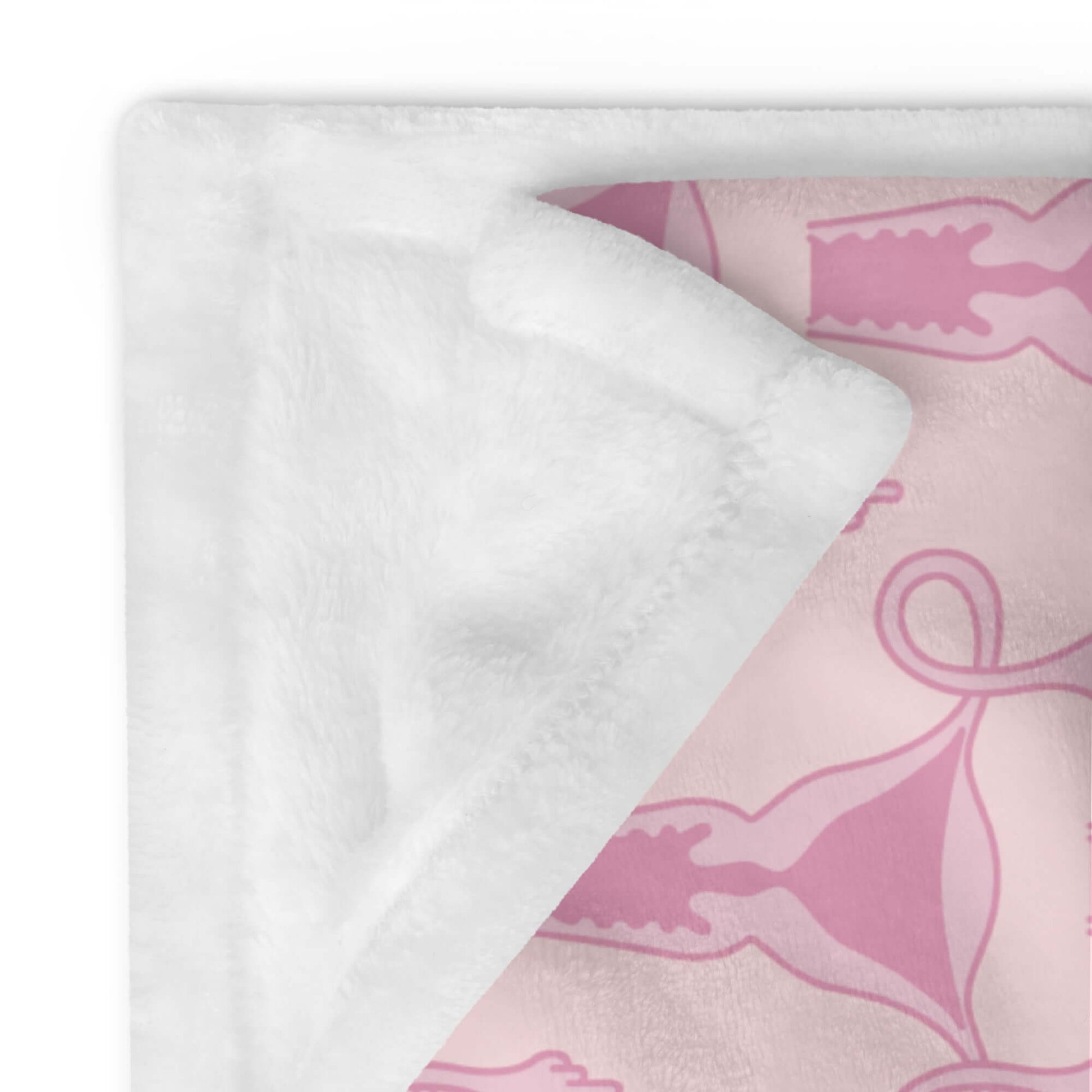 Corner of folded pink fleece throw blanket with pink uterus flipping middle finger graphic printed all over.