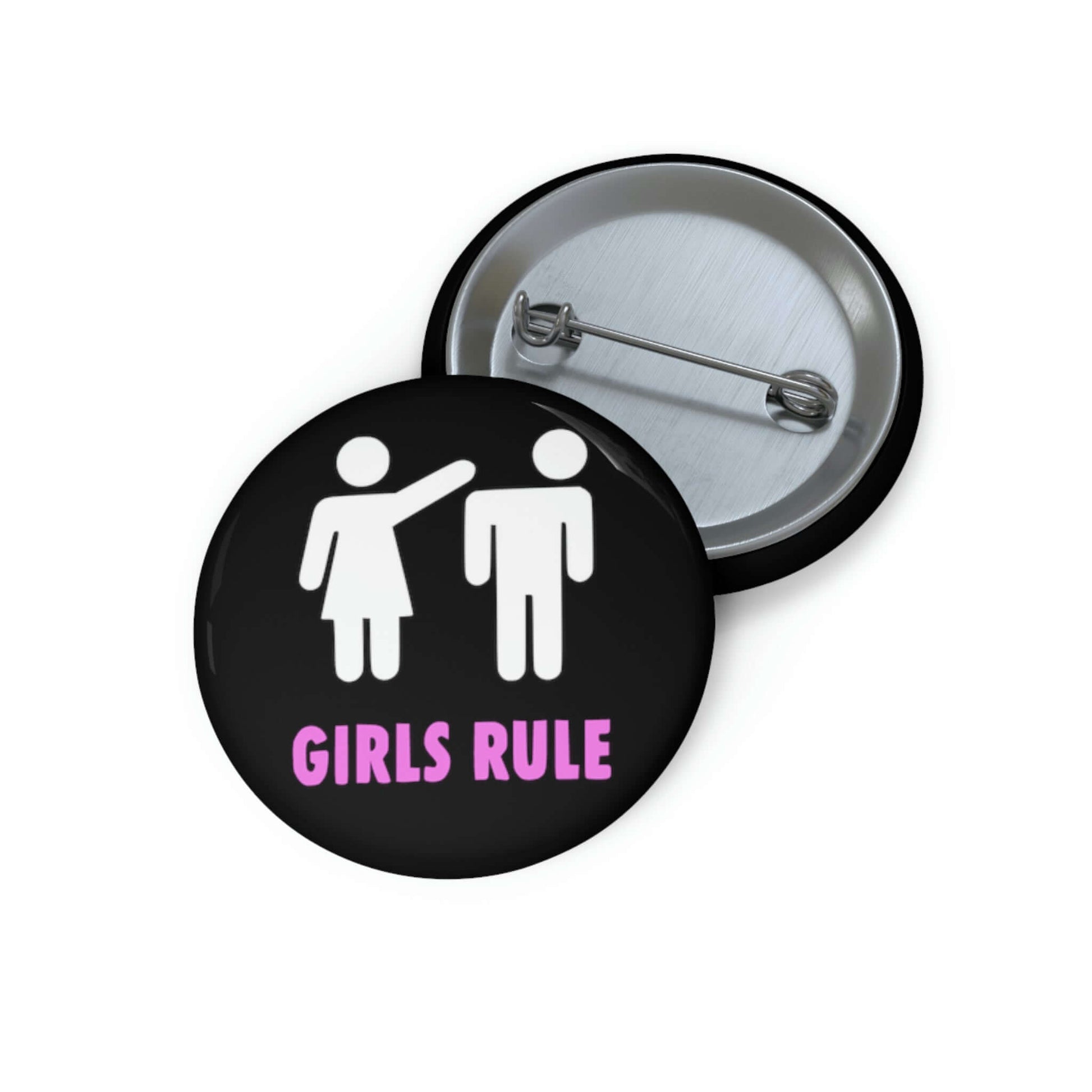 Black pin-back button with white stick figure man and woman. The woman is punching the mans head off and the words Girls rule is printed beneath in hot pink.