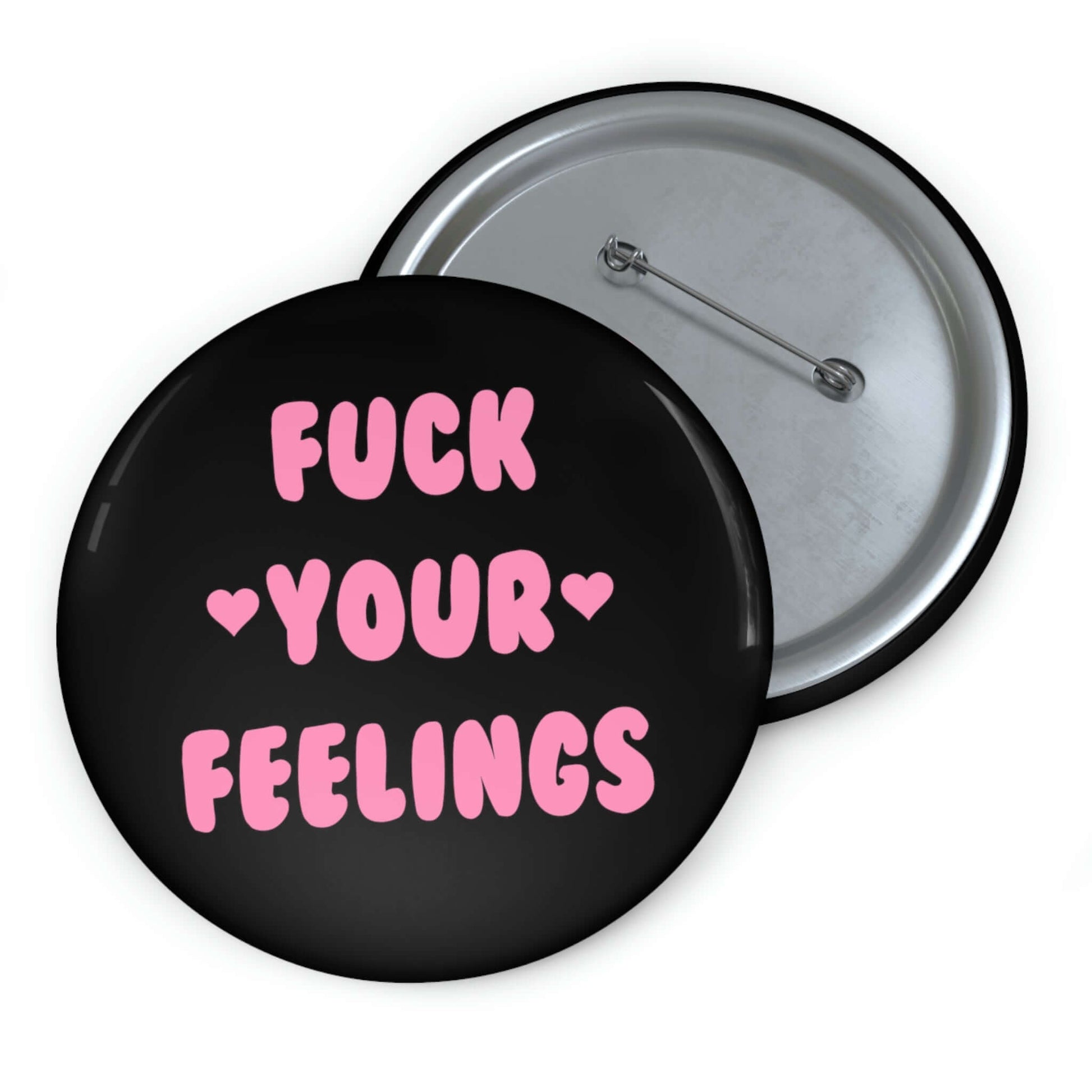 Black pinback button that says Fuck your feelings in pink. 