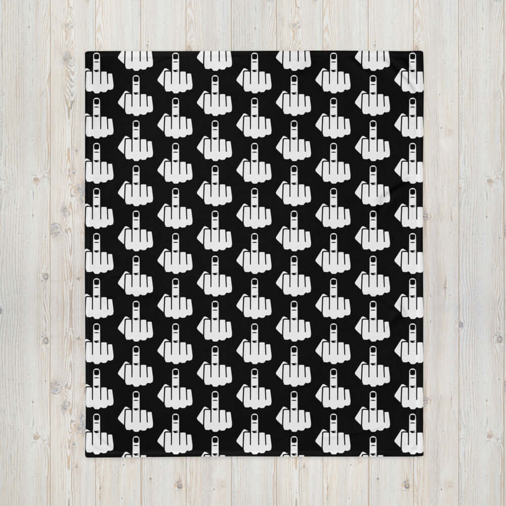 Throw blanket with image of middle finger silhouette printed all over. The blanket is black and the graphic is white.