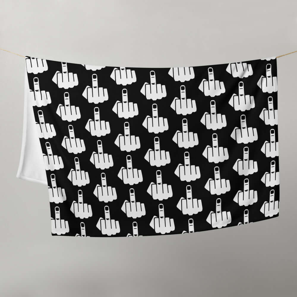 Throw blanket with image of middle finger silhouette printed all over. The blanket is black and the graphic is white.