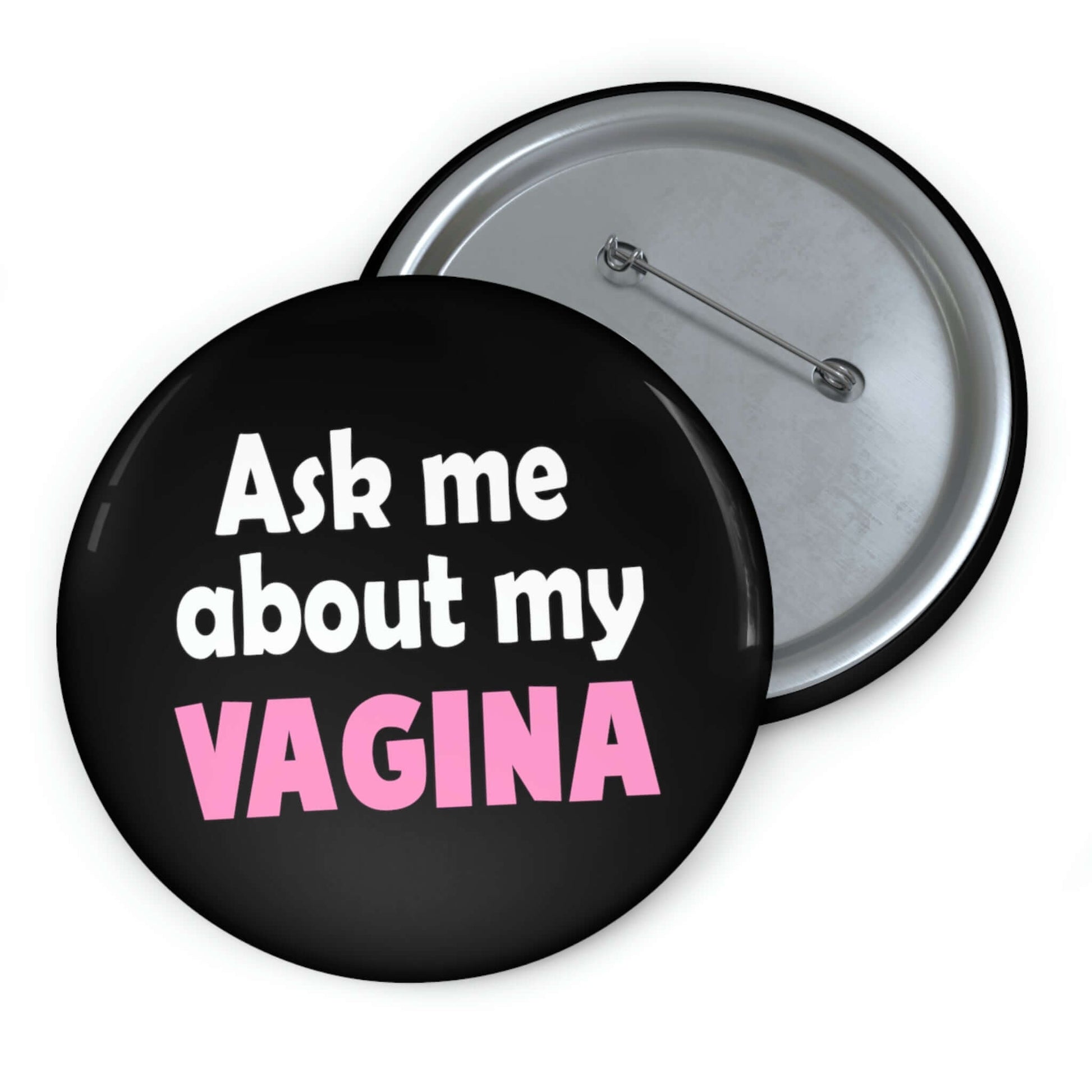 Black pinback button that says Ask me about my vagina. The word vagina is printed in pink. The rest of the text is white.