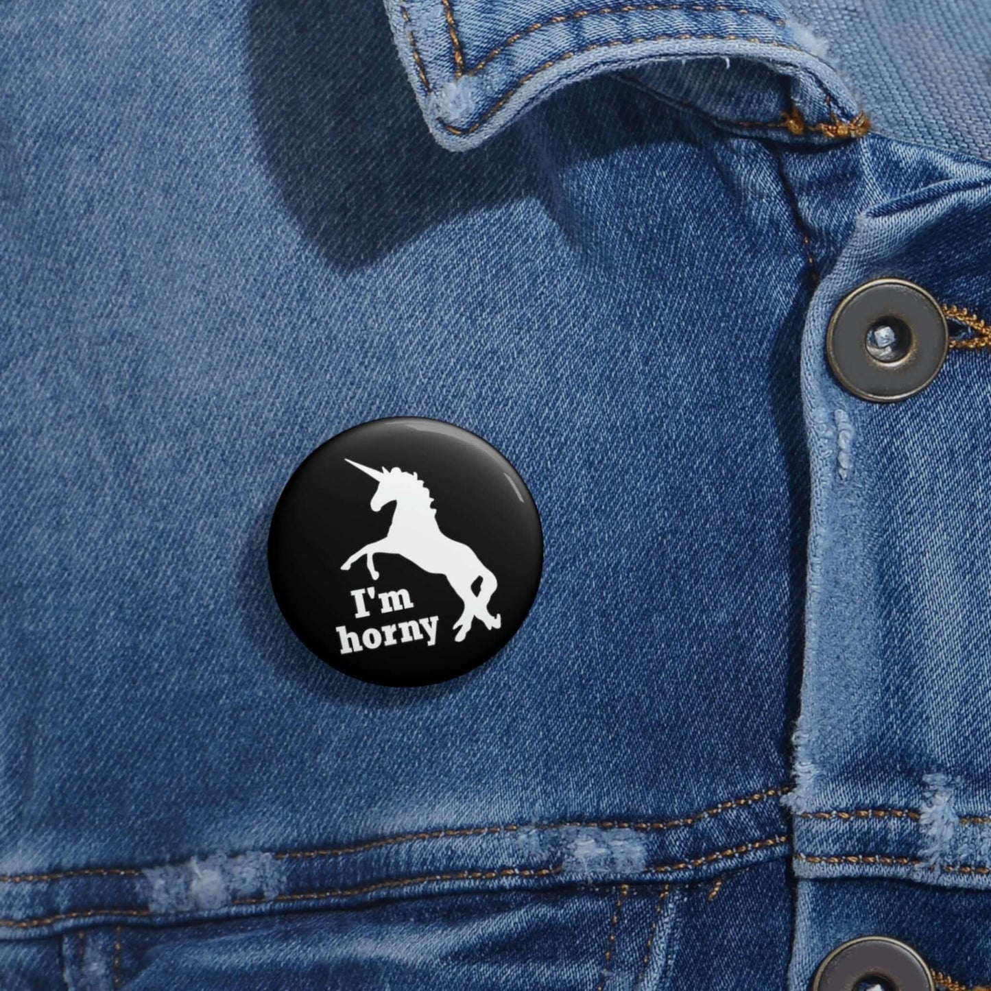 Funny pun pin-back button with silhouette image of a unicorn with the words I'm horny. 