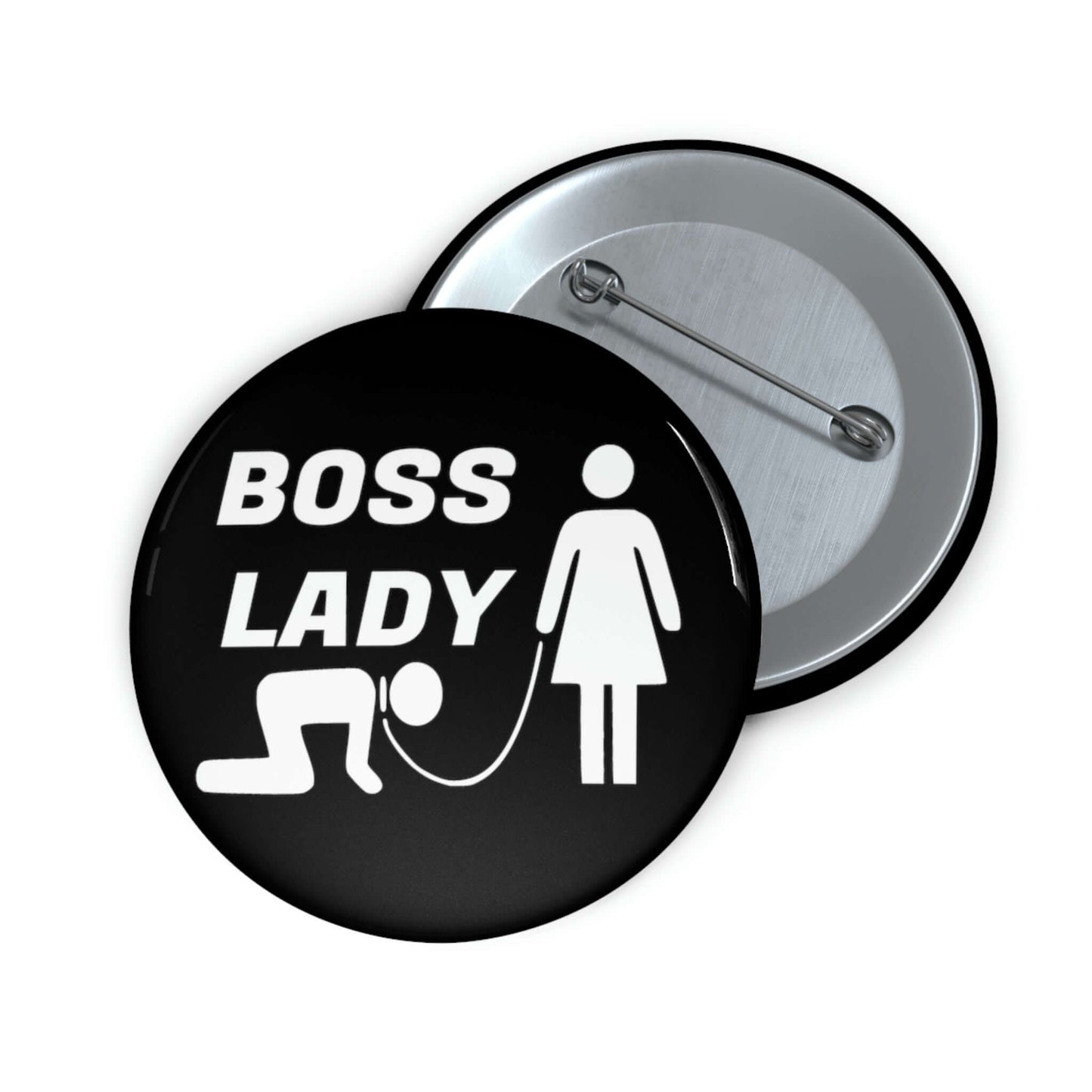 Black pinback button with graphic of collared and leashed man on his hands and knees being led by a woman and the words Boss lady.