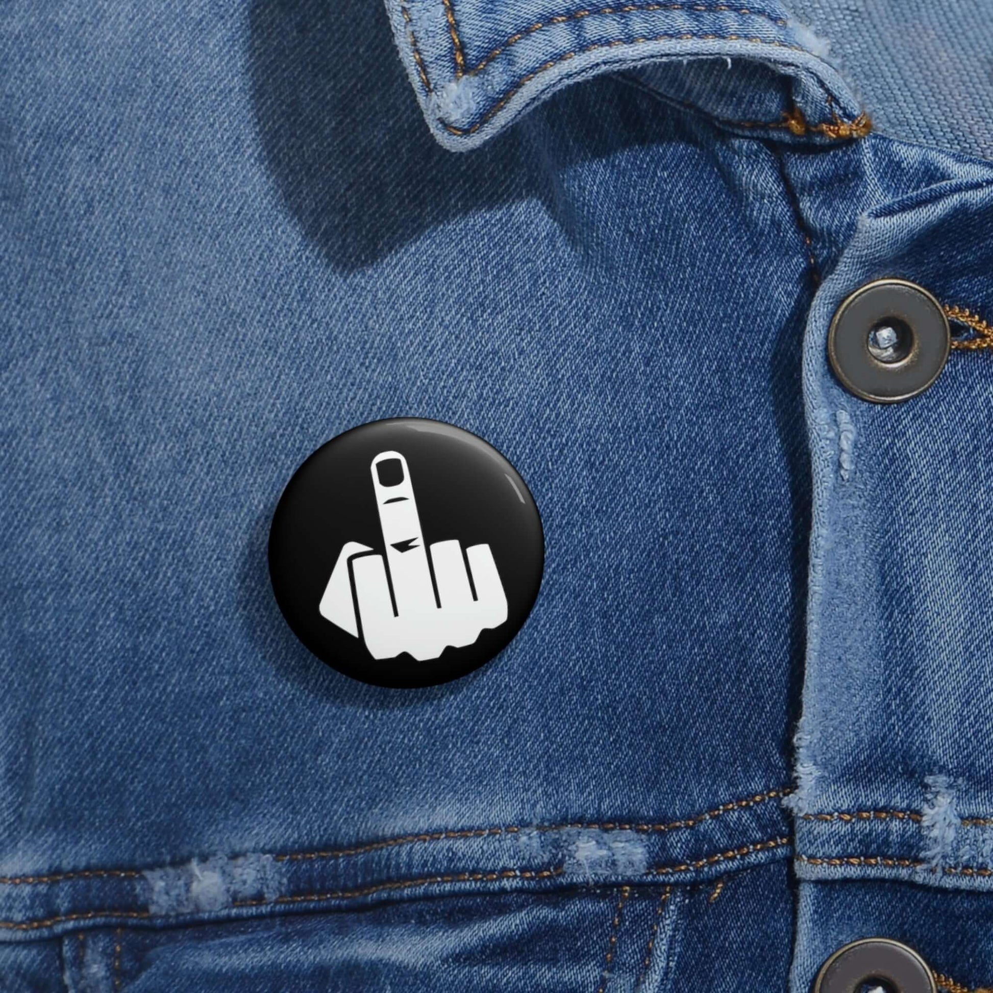 Pinback button with silhouette of middle finger.