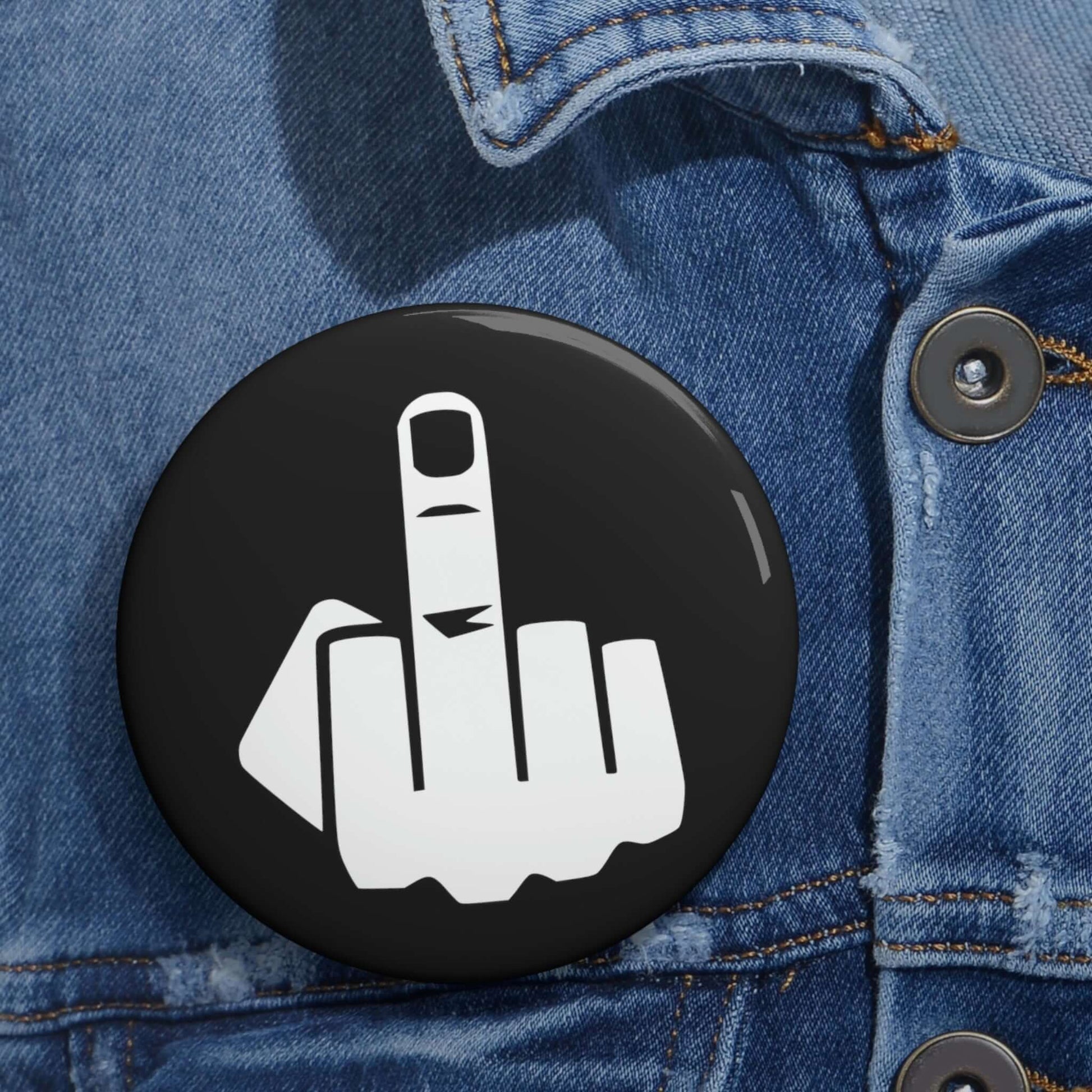 Pinback button with silhouette of middle finger.