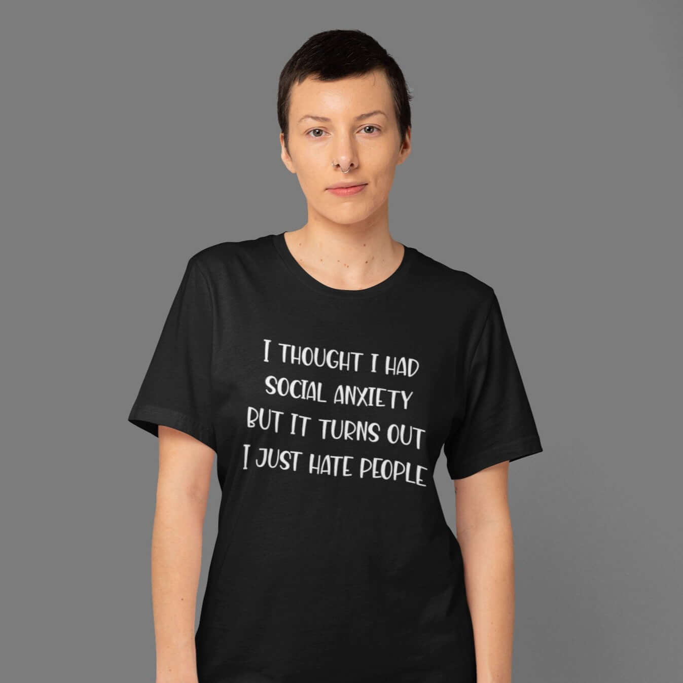 Woman wearing a black t-shirt with the phrase I thought I had social anxiety but it turns out I just hate people printed on the front.