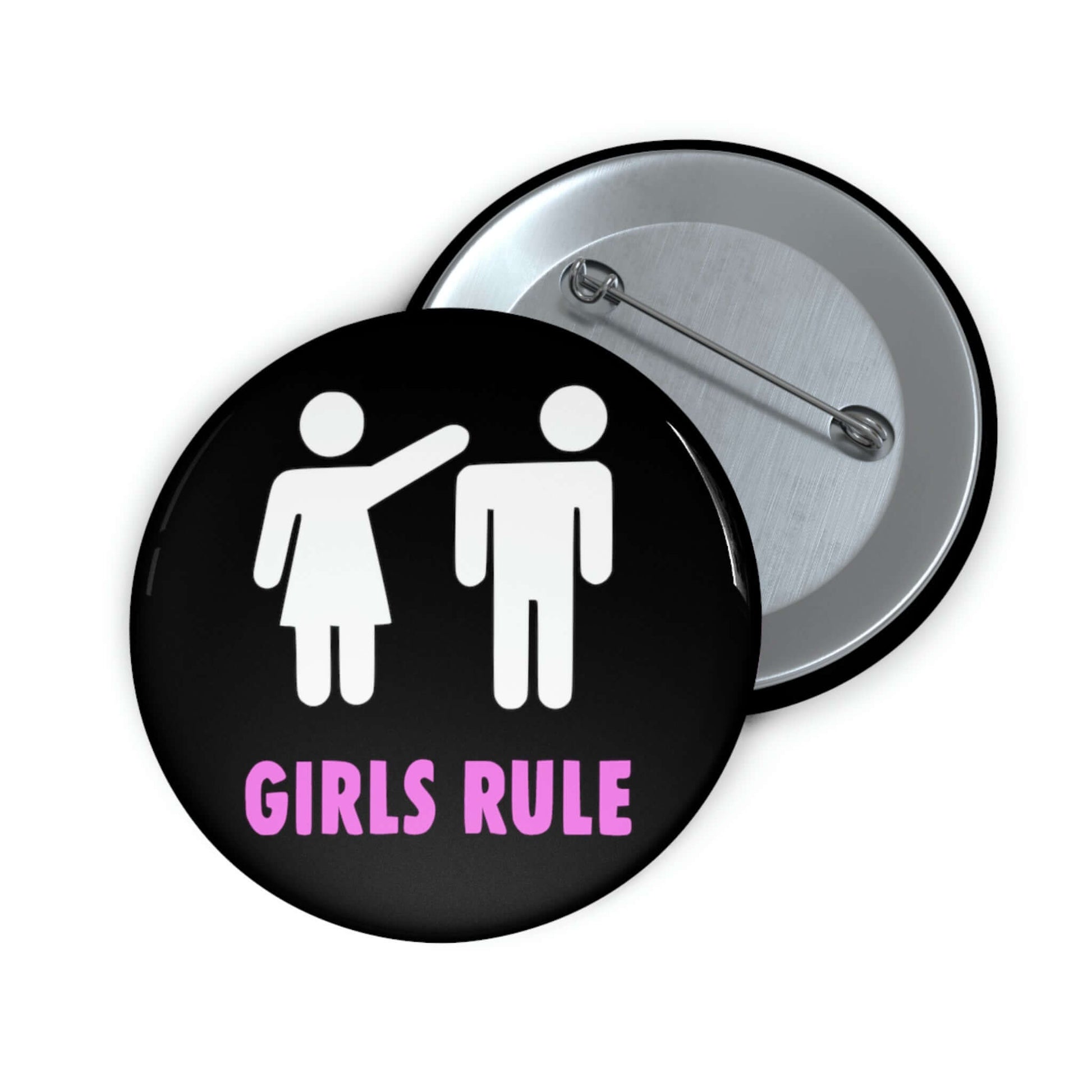 Black pin-back button with white stick figure man and woman. The woman is punching the mans head off and the words Girls rule is printed beneath in hot pink.