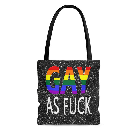 Black tote bag with the words Gay as fuck printed on both sides of the tote. The word Gay is in rainbow stripe font.