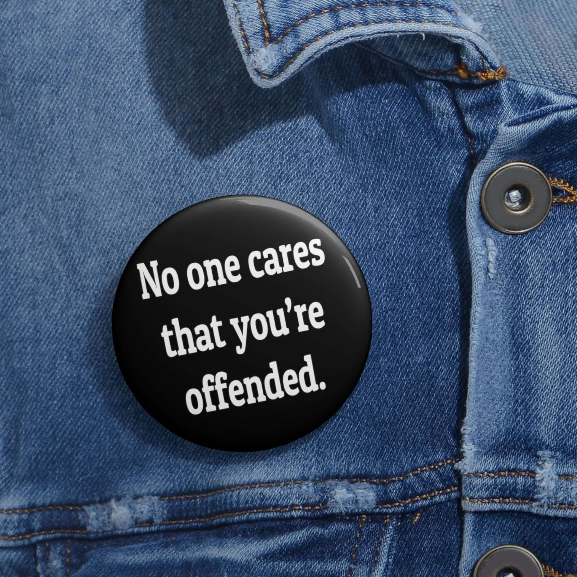 Pinback button that says No one cares that you're offended.