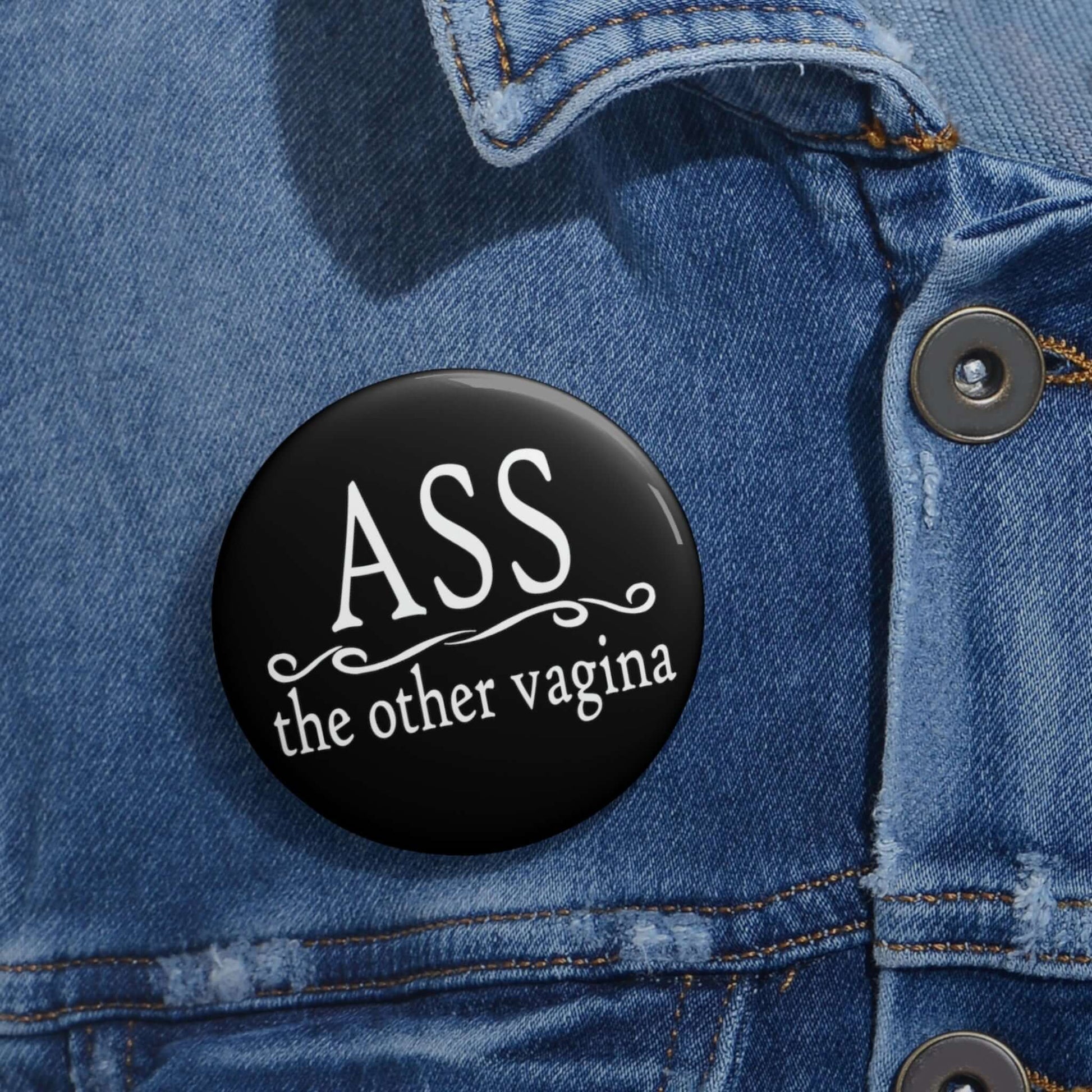Pinback button that says Ass, the other vagina.