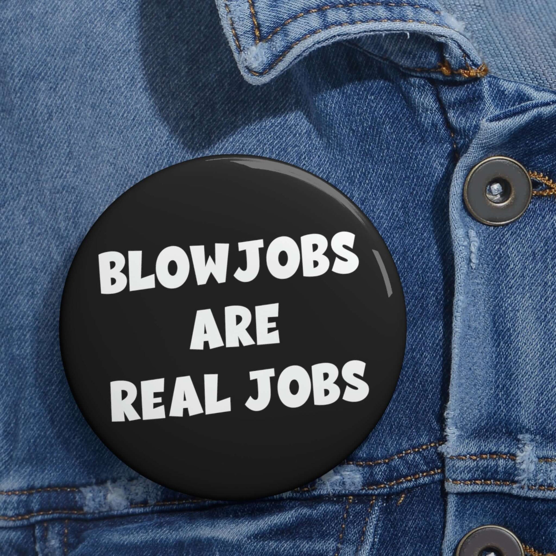 Black pinback button that says Blowjobs are real jobs.