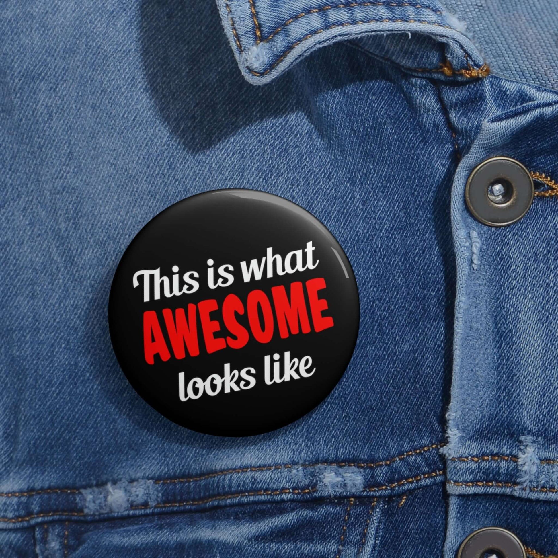 Black pinback button that says This is what awesome looks like. The word awesome is bright red.