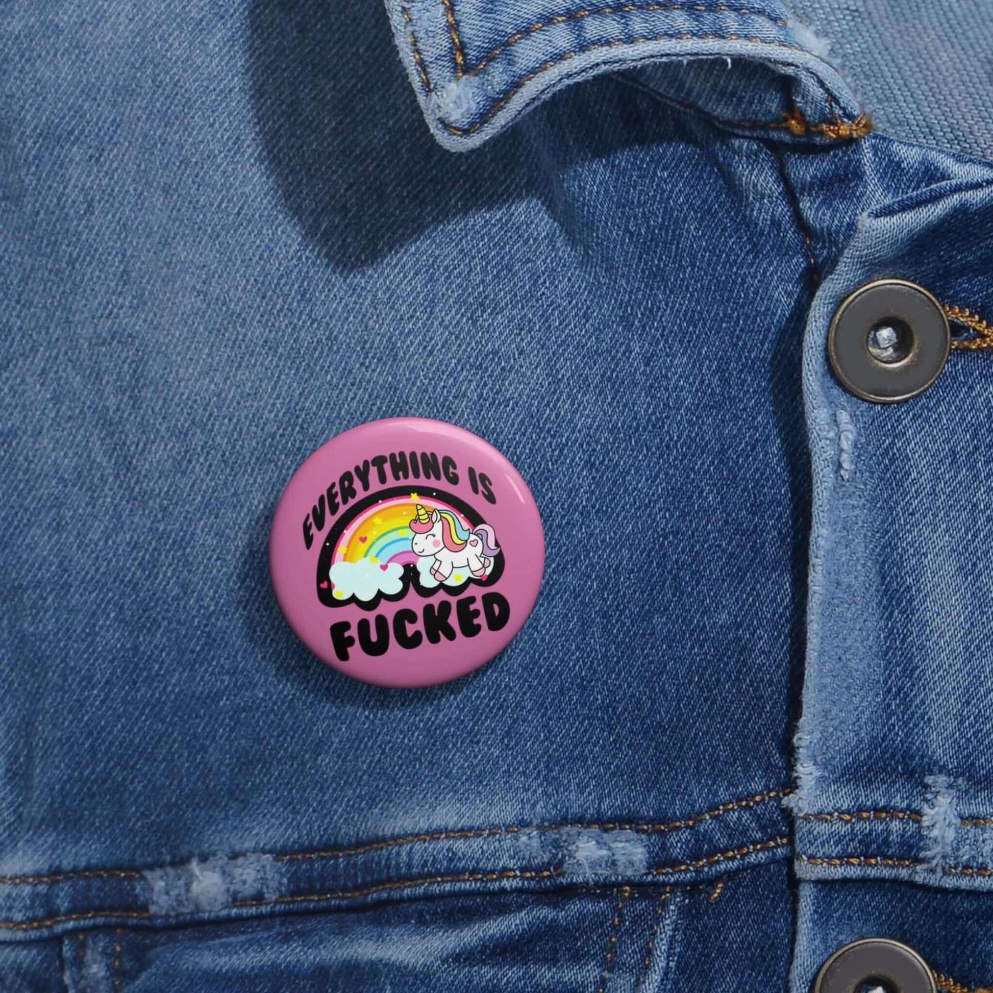 Pink pin-back button with rainbow unicorn image that says Everything is fucked.