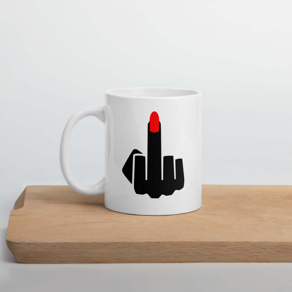 White ceramic coffee mug with image of middle finger with long red fingernail silhouette printed on both sides.