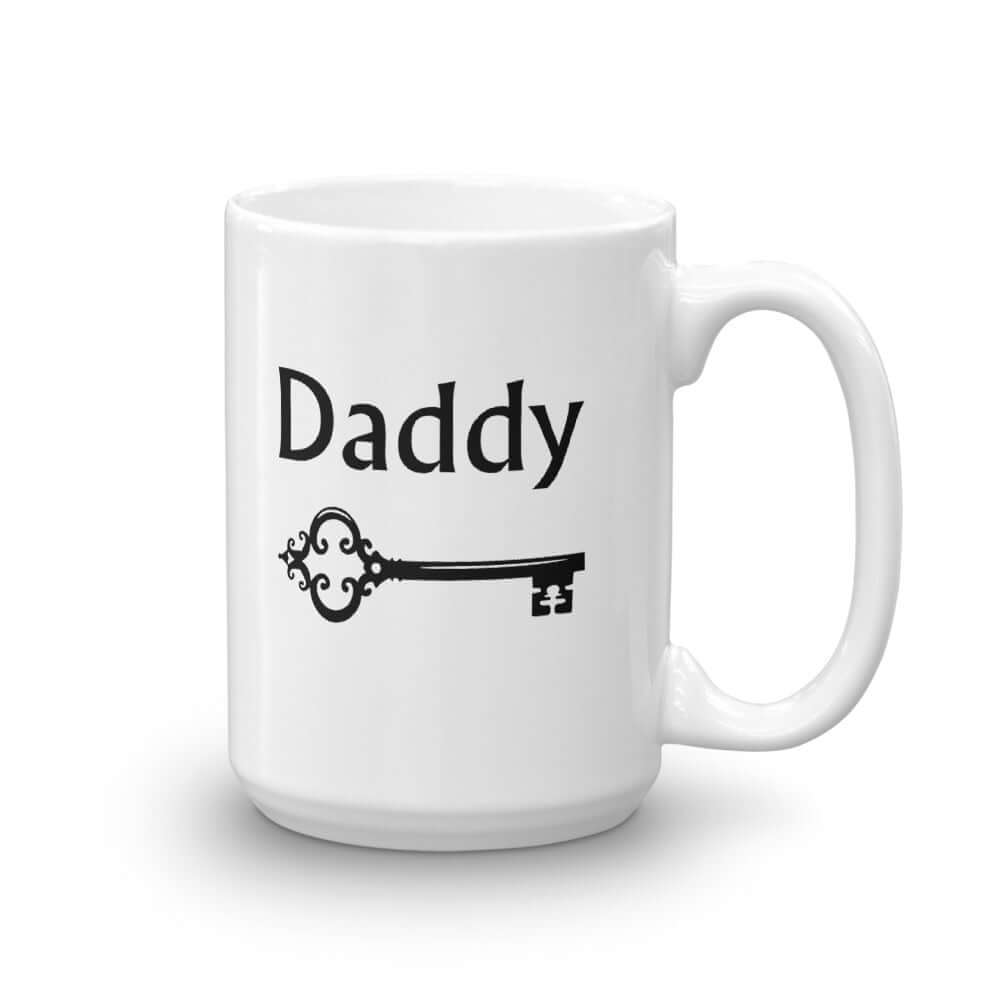 White ceramic coffee mug with an image of a BDSM key and the word Daddy printed on both sides of the mug.