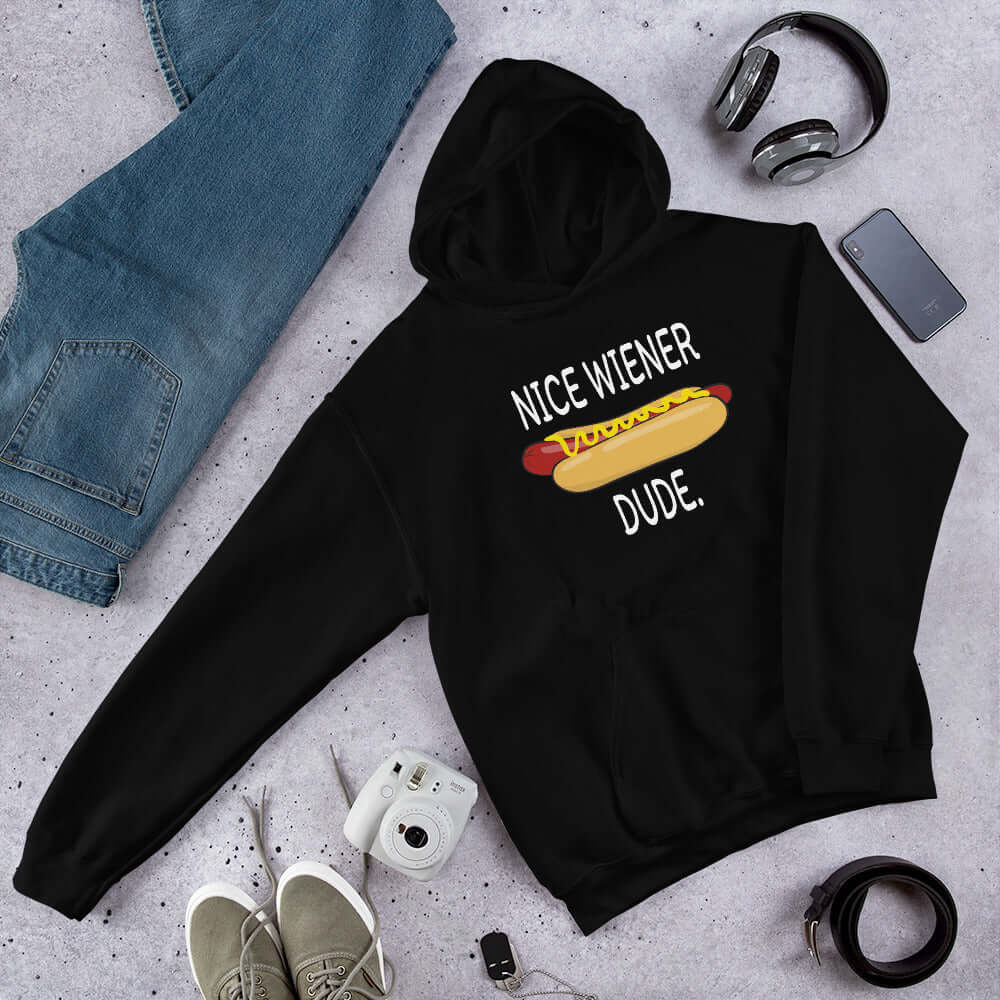 Black hoodie sweatshirt with an image of a hotdog and the phrase Nice wiener dude printed on the front.