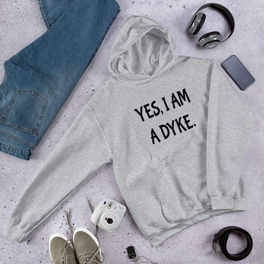 Sport grey hoodie sweatshirt with the words Yes, I'm a dyke printed on the front.