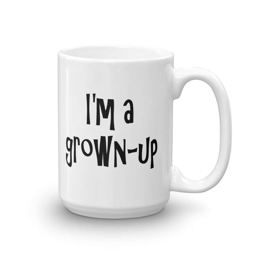 White ceramic coffee mug with the words I'm a grown-up printed on both sides of the mug.