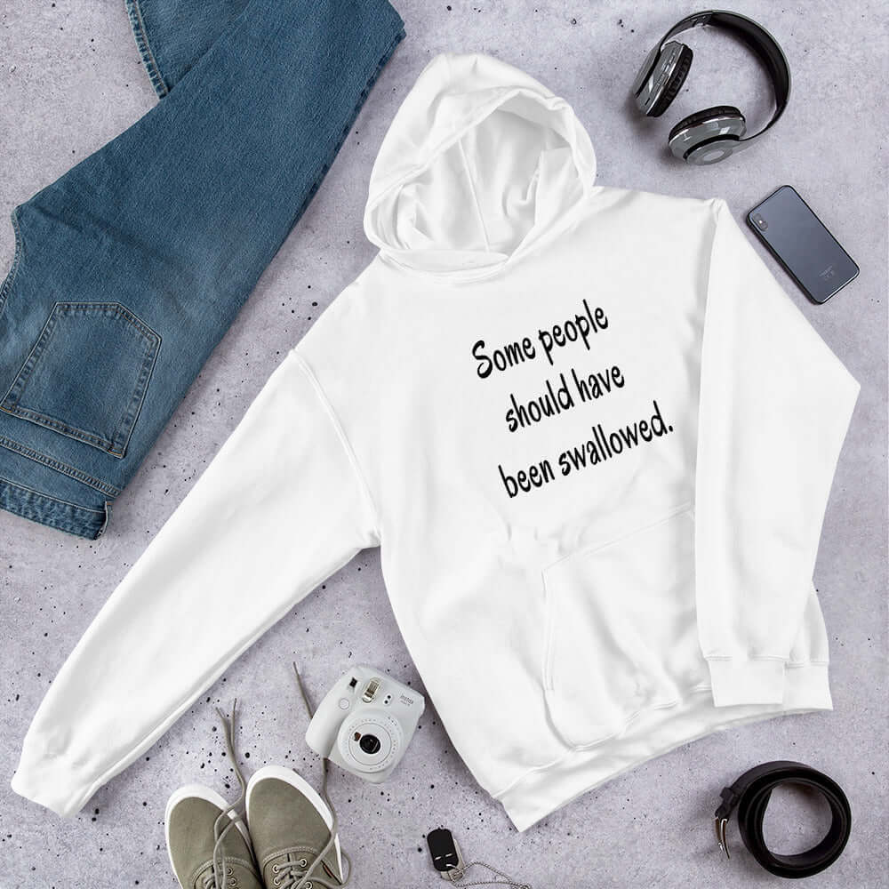 White hoodie sweatshirt with the phrase Some people should have been swallowed printed on the front.