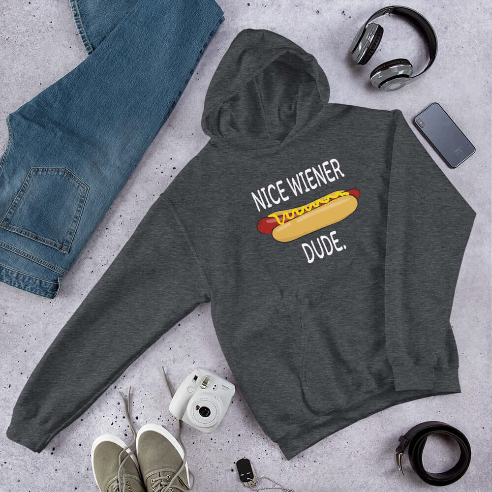 Dark heather grey hoodie sweatshirt with an image of a hotdog and the phrase Nice wiener dude printed on the front.