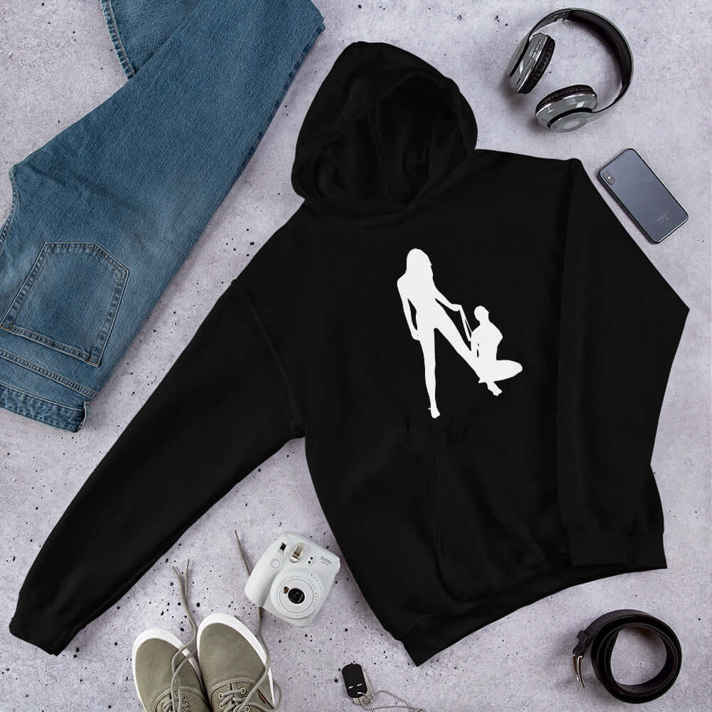 Black hoodie sweatshirt with a silhouette image of 2 women in a lesbian BDSM scene. 1 woman is on her knees and the other has her on a leash. The graphic is printed on the front of the hoodie.