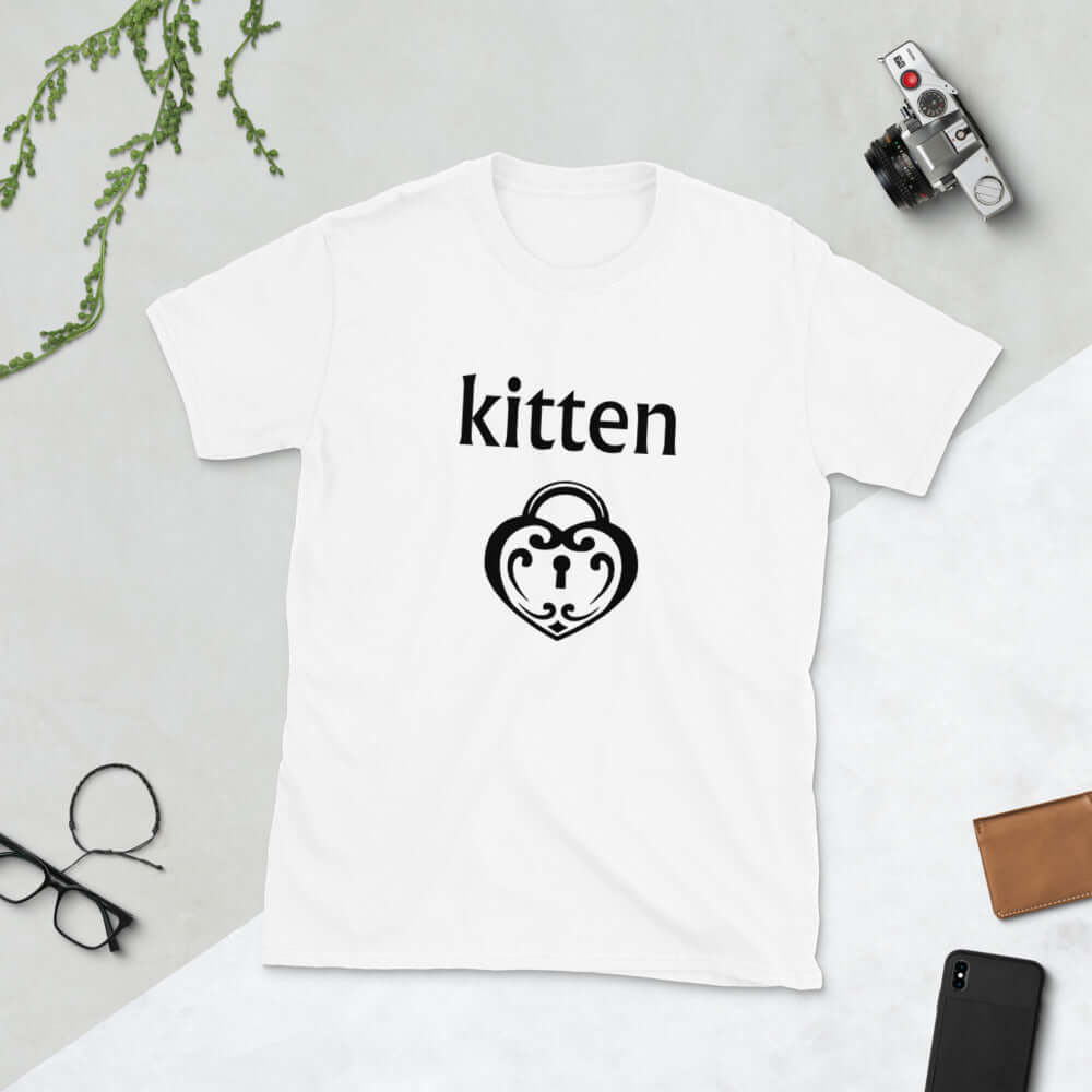 White t-shirt with an image of a BDSM heart shaped lock and the word kitten printed on the front.