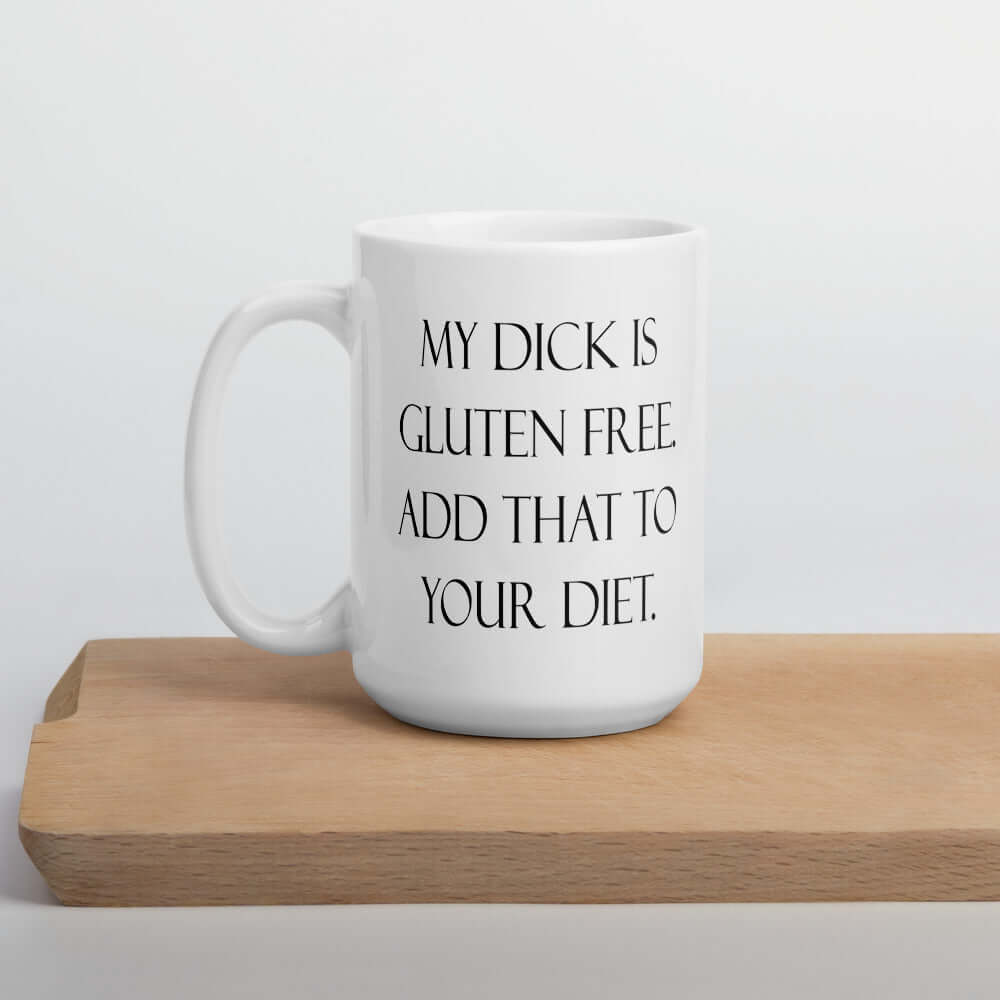 White ceramic coffee mug with the funny phrase My dick is gluten free, add that to your diet printed on both sides of the mug.