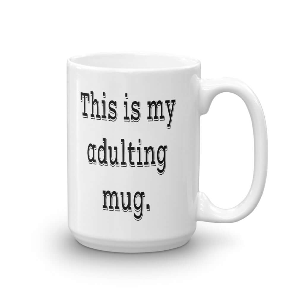 White ceramic coffee mug with the phrase This is my adulting mug printed on both sides of the mug.