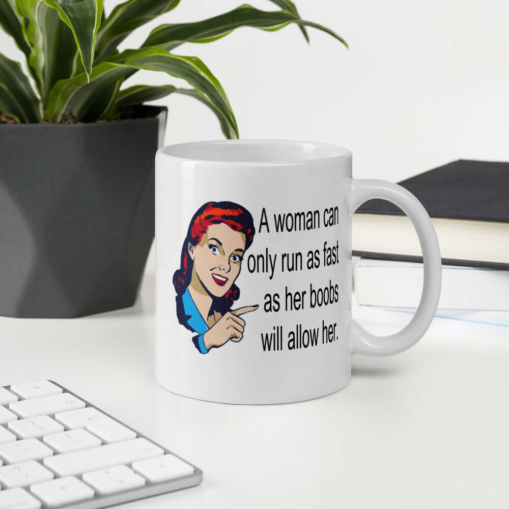 White ceramic coffee mug with an image of a retro woman and the phrase A woman can only run as fast as her boobs will allow printed on both sides of the mug.