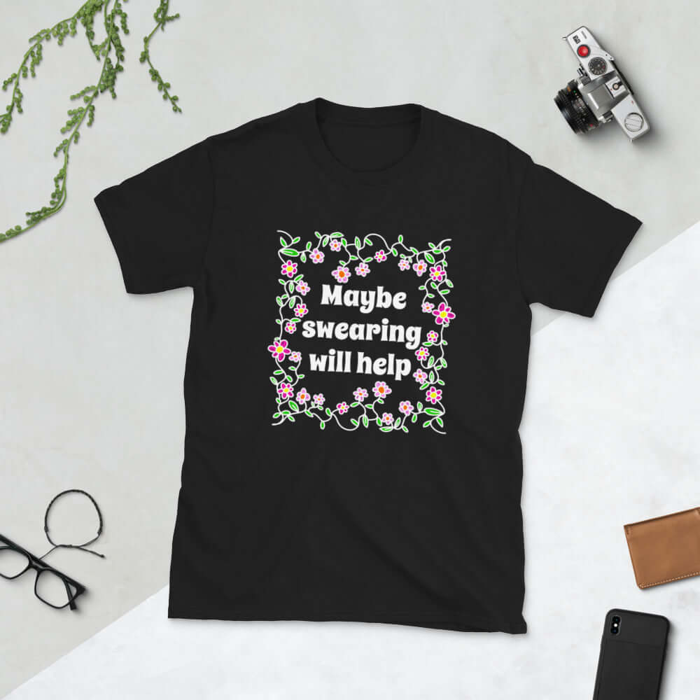 Black t-shirt with a floral graphic and the phrase Maybe swearing will help printed on the front.