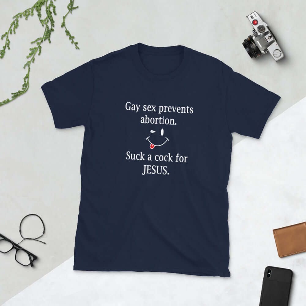 Navy blue t-shirt with the phrase Gay sex prevents abortion. Suck a cock for Jesus printed on the front.